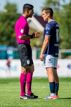 Mohammad Usman Aslam, referee, and Tommy Høiland of Viking