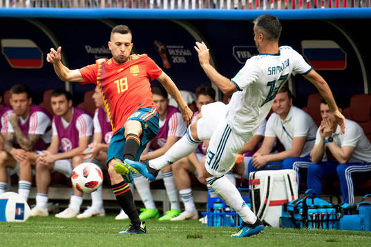 Jordi Alba of Spain and Alexey Miranchuk of Russia