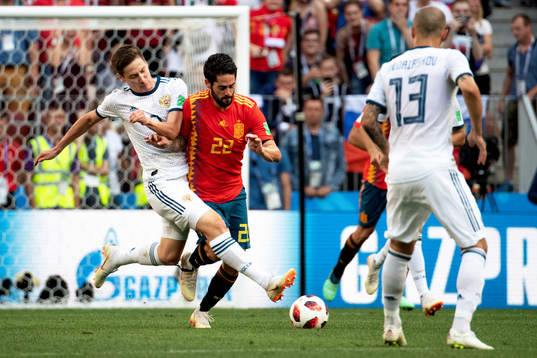 Daler Kuziaev of Russia and Isco of Spain