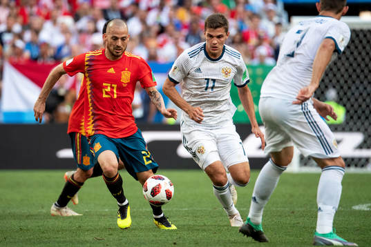 David Silva of Spain and Roman Zobnin of Russia