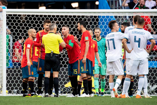 referee Björn Kuipers talks to Sergio Ramos of Spain