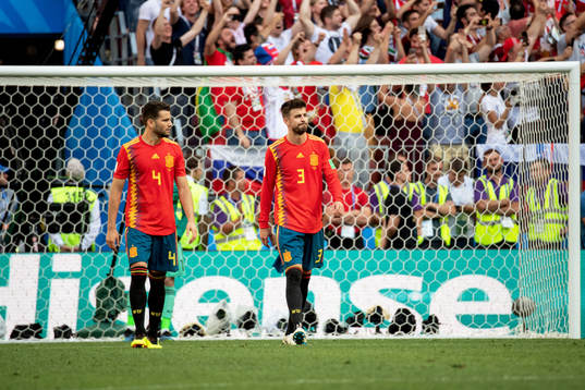 Nacho and Gerard Pique of Spain looks dejected