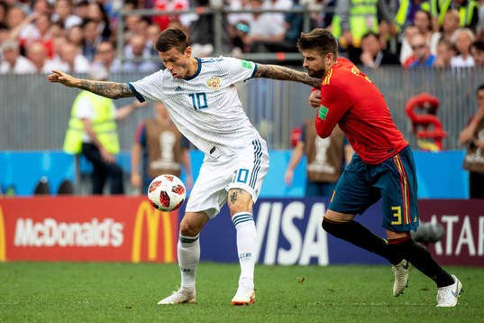 Fedor Smolov of Russia and Gerard Pique of Spain