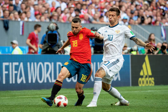 Jordi Alba of Spain and Fedor Smolov of Russia