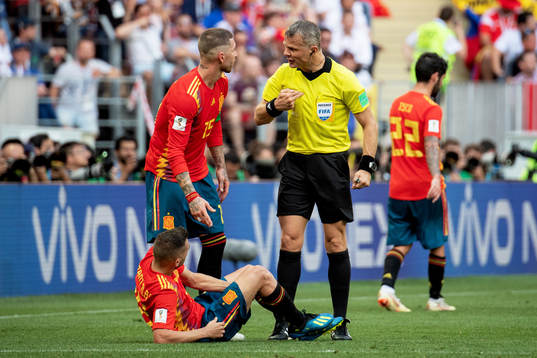 referee Björn Kuipers and Sergio Ramos of Spain