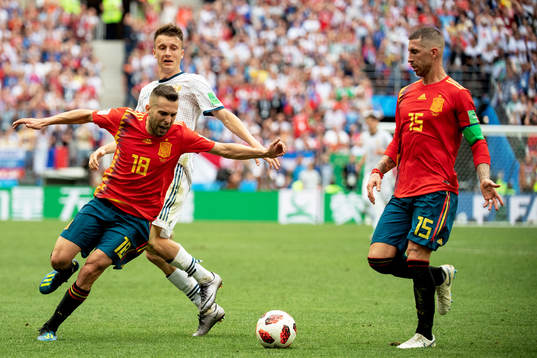 Aleksandr Golovin of Russia and Jordi Alba and Sergio Ramos