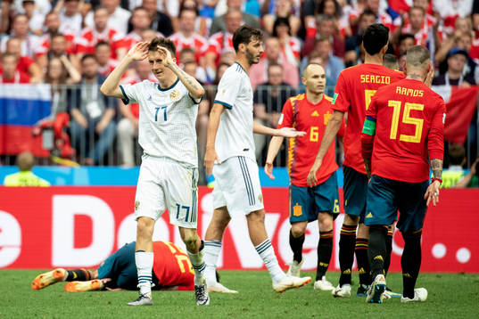 Aleksandr Golovin of Russia looks dejected