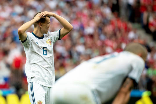 Denis Cheryshev of Russia looks dejected