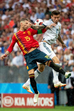 Fedor Smolov of Russia and Sergio Ramos of Spain