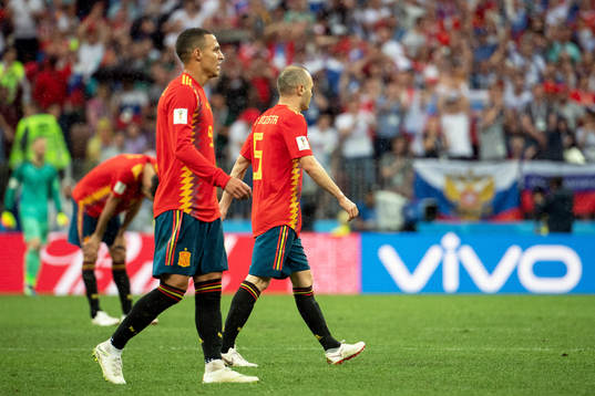 Players of Spain looks dejected