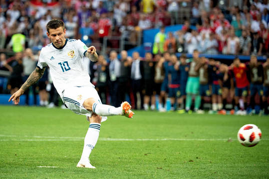 Fedor Smolov of Russia shoot a penalty