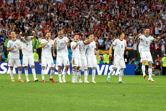 Russia celebrates with his teammates