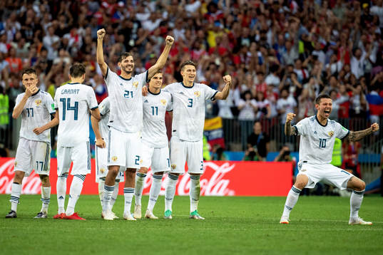 Russia celebrates with his teammates