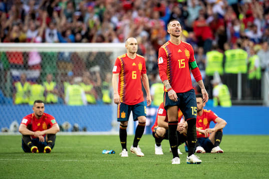 Andres Iniesta and Sergio Ramos of Spain looks dejected