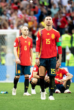 Andres Iniesta and Sergio Ramos of Spain looks dejected