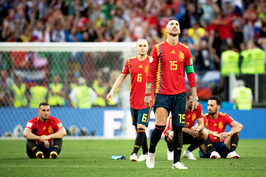 Andres Iniesta and Sergio Ramos of Spain looks dejected