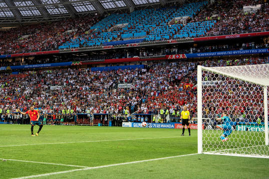 goalkeeper Igor Akinfeev of Russia saves a penalty from