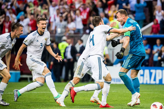Goalkeeper Igor Akinfeev celebrates with team mates