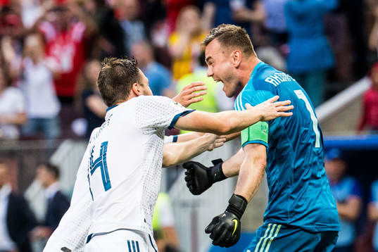 Goalkeeper Igor Akinfeev of Russia celebrates with Vladimir