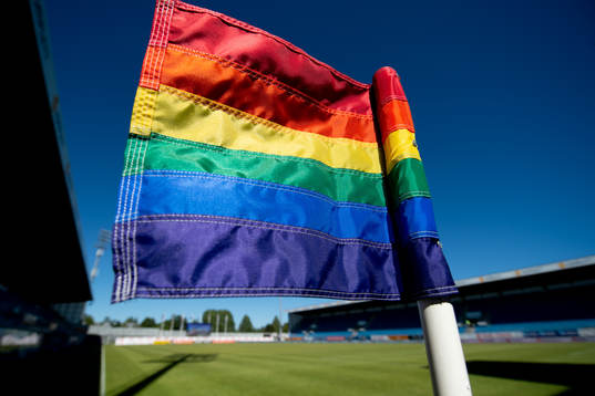 A rainbow-colored corner flag at Komplett Arena
