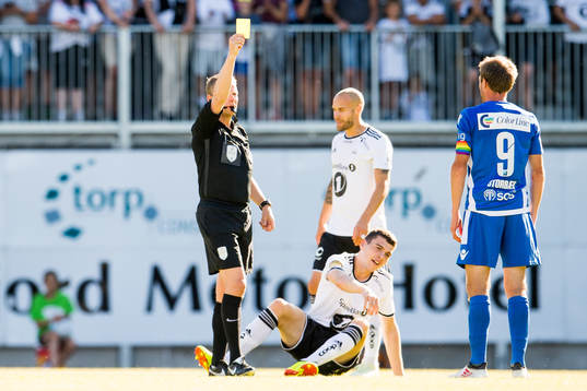 Håvard Storbæk of Sandefjord is shown a yellow card by