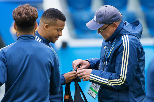 Martin Olsson and head coach Janne Andersson of the Swedish