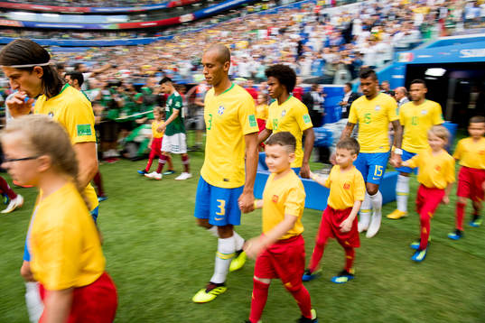 Miranda of Brazil enters the pitch