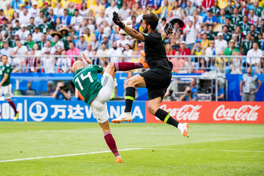 Javier Hernandez of Mexico and goalkeeper Jose Corona of