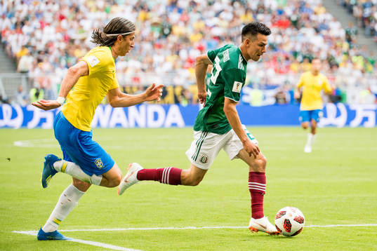 Filipe Luis of Brazil and Hirving Lozano of Mexico