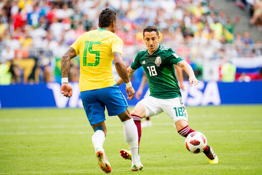 Paulinho of Brazil and Andres Guardado of Mexico