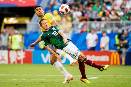 Andres Guardado of Mexico and Casemiro of Brazil
