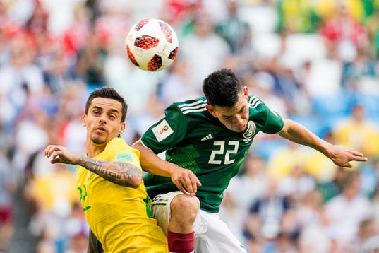 Fagner of Brazil and Hirving Lozano of Mexico