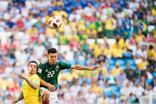 Fagner of Brazil and Hirving Lozano of Mexico
