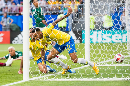 Neymar and Paulinho of Brazil celebrate the 1-0 goal