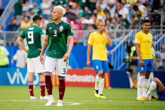 Carlos Salcedo of Mexico looks dejected