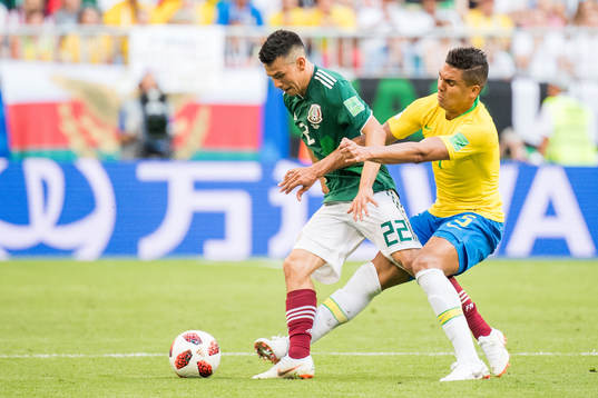 Hirving Lozano of Mexico and Casemiro of Brazil