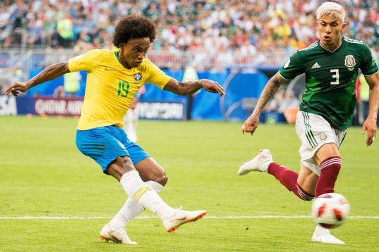 Willian of Brazil and Carlos Salcedo of Mexico