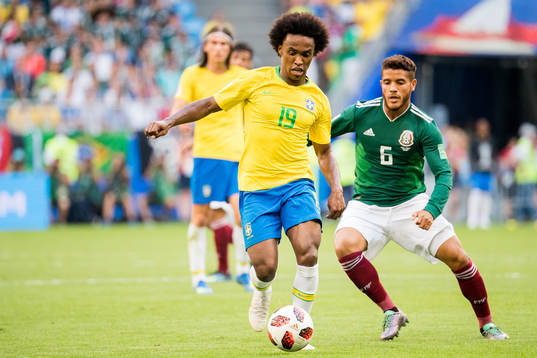 Willian of Brazil and Jonathan Dos Santos of Mexico