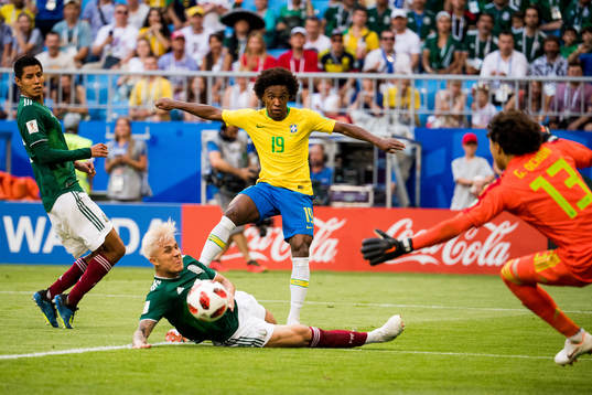 Carlos Salcedo of Mexico and Willian of Brazil