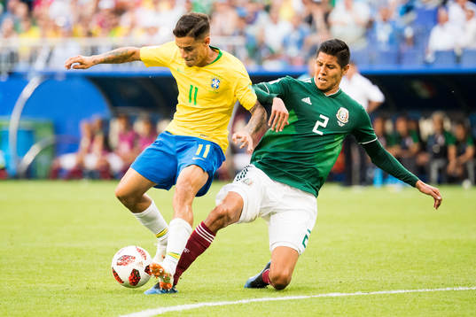 Philippe Coutinho of Brazil and Hugo Ayala of Mexico