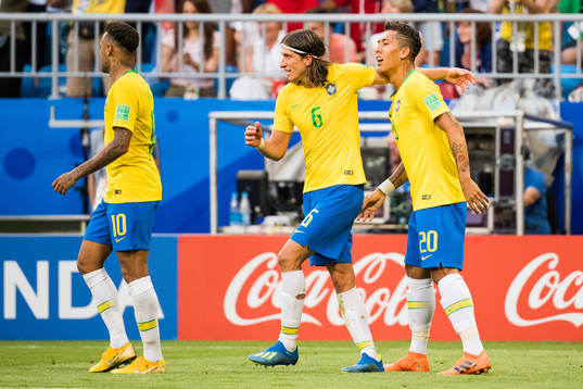 Roberto Firmino of Brazil celebrates with Filipe Luis of