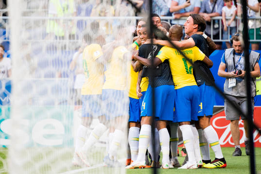 Players of Brazil celebrates the 2-0 goal by Roberto Firmino