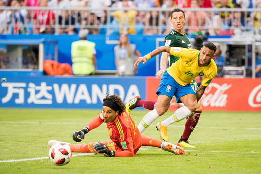 Goalkeeper Guillermo Ochoa of Mexico and Neymar of Brazil