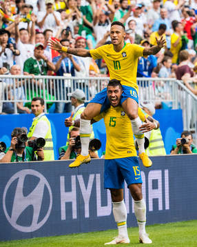 Neymar of Brazil celebrates with Paulinho
