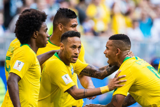 Neymar of Brazil celebrates with team mates
