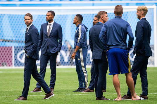 Marcus Rohdén of Sweden inspects the pitch with team mates