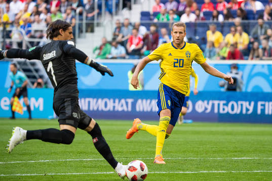 goalkeeper Yann Sommer clears the ball in fornt of Ola