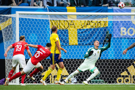 Blerim Dzemaili of Switzerland with a shot against