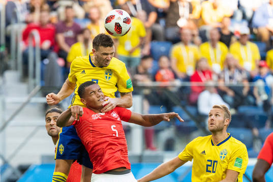 Marcus Berg and Ola Toivonen competes for the ball with