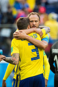 Andreas Granqvist hugs Victor Nilsson Lindelöf of Sweden